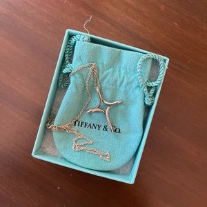 Tiffany’s Infinity Cross Pendant Necklace